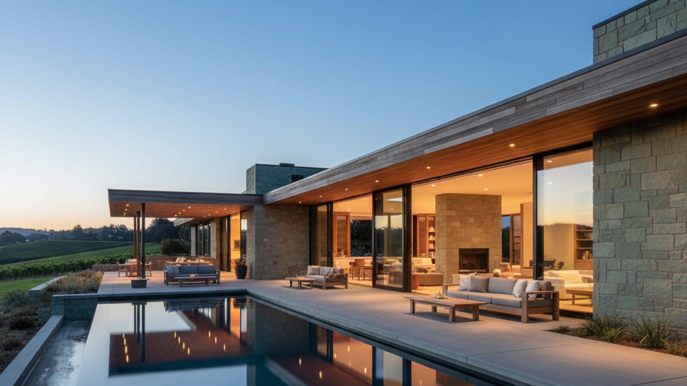 Luxury wine country residence featuring indoor-outdoor living spaces, infinity pool, and seamless natural material integration